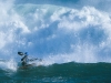 USA, California, Santa Cruz. Kayak surfing in storm at Santa Cruz Kayak Surf Festival. (MR).