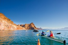 Sea kayaking along the shore of Isla Carmen, Sea of Cortez, Baja, Mexico.