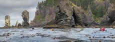Sea kayakers paddling at Cape Flattery on the Olympic Coast.