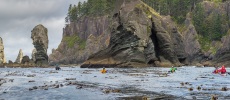 Sea kayakers paddling at Cape Flattery on the Olympic Coast.