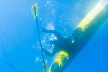 Underwater view of kayaker on a mountain lake. Washington State, USA.