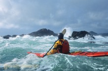 Sea kayaker Tim Walsh in confused seas and 17 ft swell off Chichigof Island, Southeast Alaska.