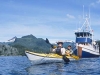 Kayak mothership Home ShoreLeaving the mothership Home Shore by sea kayak in Redfish Bay, Baranof Island, AK.