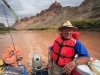 Colorado River\'s Cataract Canyon. Bob Jones of Tag-A-Long Expeditions confidently pilots the motorized raft through Catacarct Canyon on the Colorado.