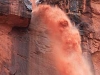 Fire Hose. Torrent of rain created a Yosemite-in-Red with water blasting off the flat faces of the Wingate formation and other cliffs of Cataract Canyon.