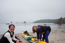 Women packing their sea kayaks at Toleak Point, Olympic National Park, Washington State. (MR)