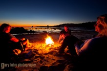 Kayakers at campfire at Toleak Point, Olympic Coast, Olympic National Park, Washington State.