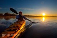 Sea kayaker at dawn on Lake Washington, Seattle, Washington State.
