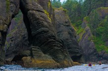 Sea kayakers explore sea stacks and arches at Cape Flattery, Olympic Penninsula, Washington State.