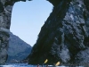 Astrolabe Arch. Sea kayakers pass through Astrolabe Arch, Glacier Bay National Park, Gulf of Alaska, AK.