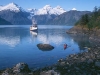 Lituya Bay. A paddler and mothership Home Shore in Lituya Bay, part of Glacier Bay National Park. Fairweather Range in background.
