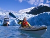 Paddling near the shear blue walls of the tidewater South Sawyer Glacier. Tracy Arm is like a Yosemite Valley on water - granite faces, plunging waterfalls, and no place to camp.