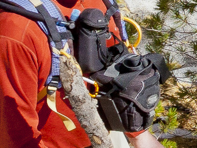 Top-load Tamrac 3330 with carabineers to attach to shoulder strap. Rich says the weight transfers from shoulder strap to hips (where it belongs) with a properly-fitted pack.
