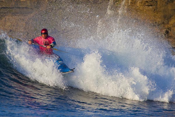 From the kayak: The world excites. Rich, warm morning light; front-lit; engaging perspective. The waves may be small, but the low angle pumps them up. A four-footer looms large. 300mm f/4 w/1.4x, f/6.3, 1/2000sec, ISO 400