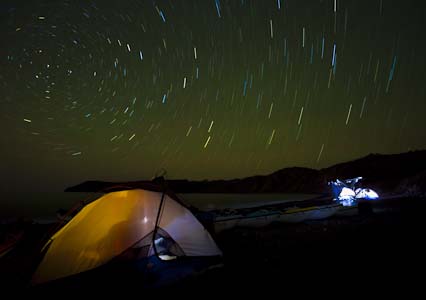 Star-trail at Isla Carmen, Baja, MX. I fired the flash seven times inside the tent, with a warming gel