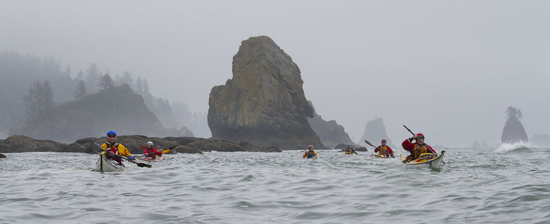 Same image as above but with the sky darkened .74 stop and a bit of vibance added. Image is stronger, with the eye directed to the kayakers, and background more ominous.