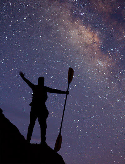 Kayaker with paddle, and the Milky Way. Canon 5D II, 50mm f/1.8, ISO 1600, f/2.5, 25 sec.