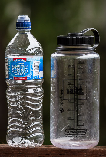 No brainer: 32 oz. Nalgene bottle weighs 6.2 oz. Twenty-four oz. (Mountain Spring) bottle weighs .7 oz. Nalgenes are great for sea kayak trips; backpacking, not so much.