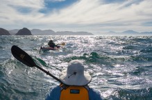 Sea kayakers experience some rough water rounding Punta Lobos, Isla Carmen, Baja, MX. (MR)