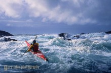 Sea kayaker Tim Walsh in confused seas and 17 ft swell off Chichigof Island, Southeast Alaska.